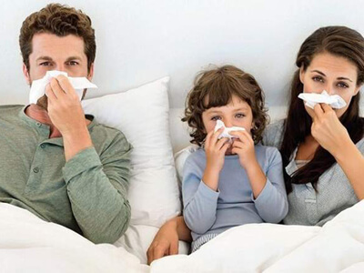 Family covering their nose 